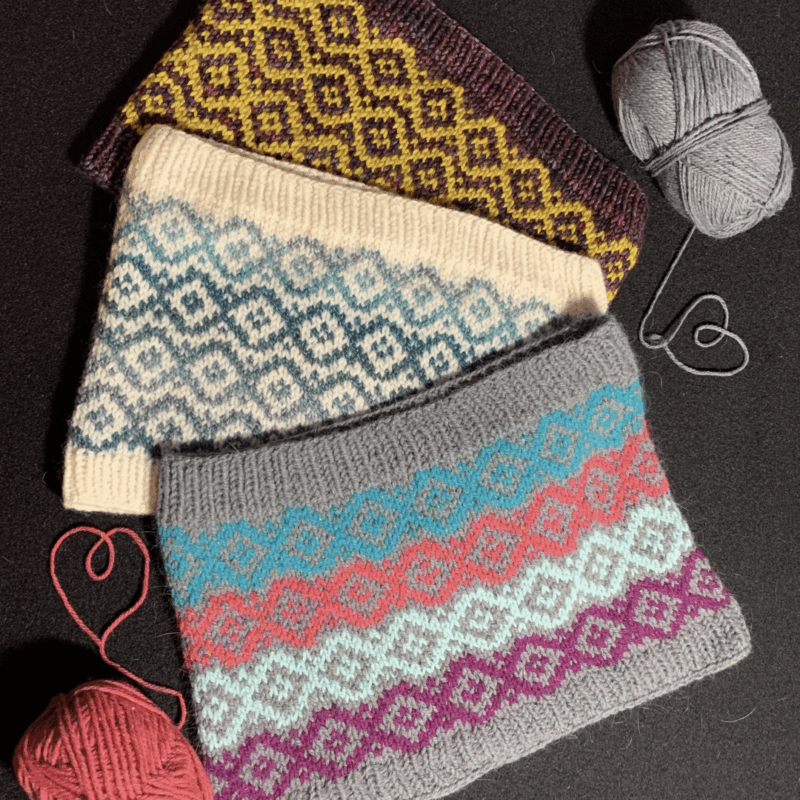 Knit cowls using two or more colors of yarn to do stranded or Fair Isle knitting.
